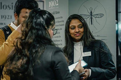 Delegates at networking event smiling
