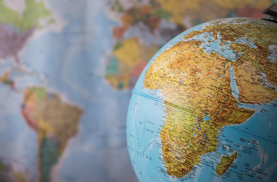 Globe in front of map