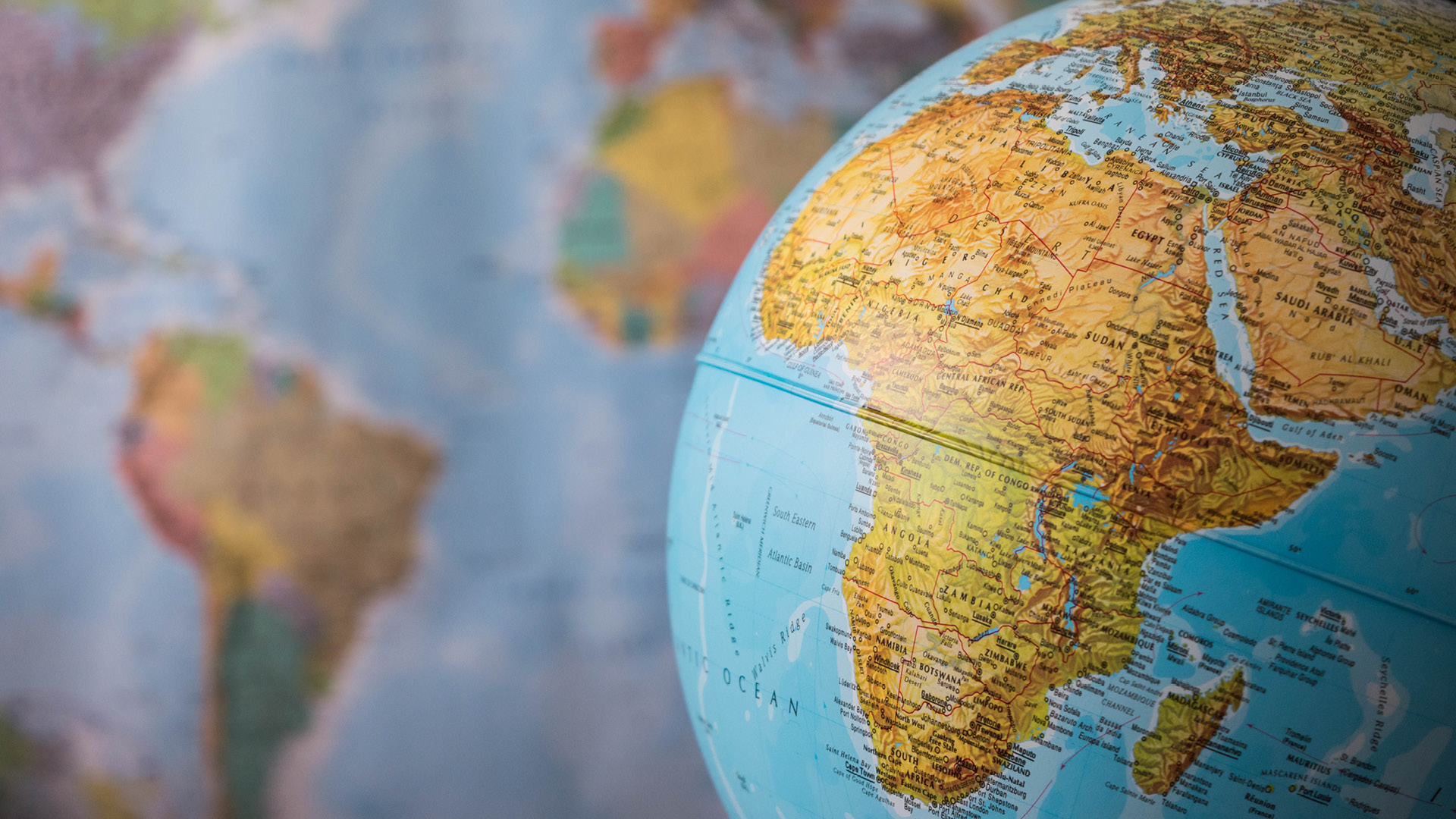 Globe in front of map