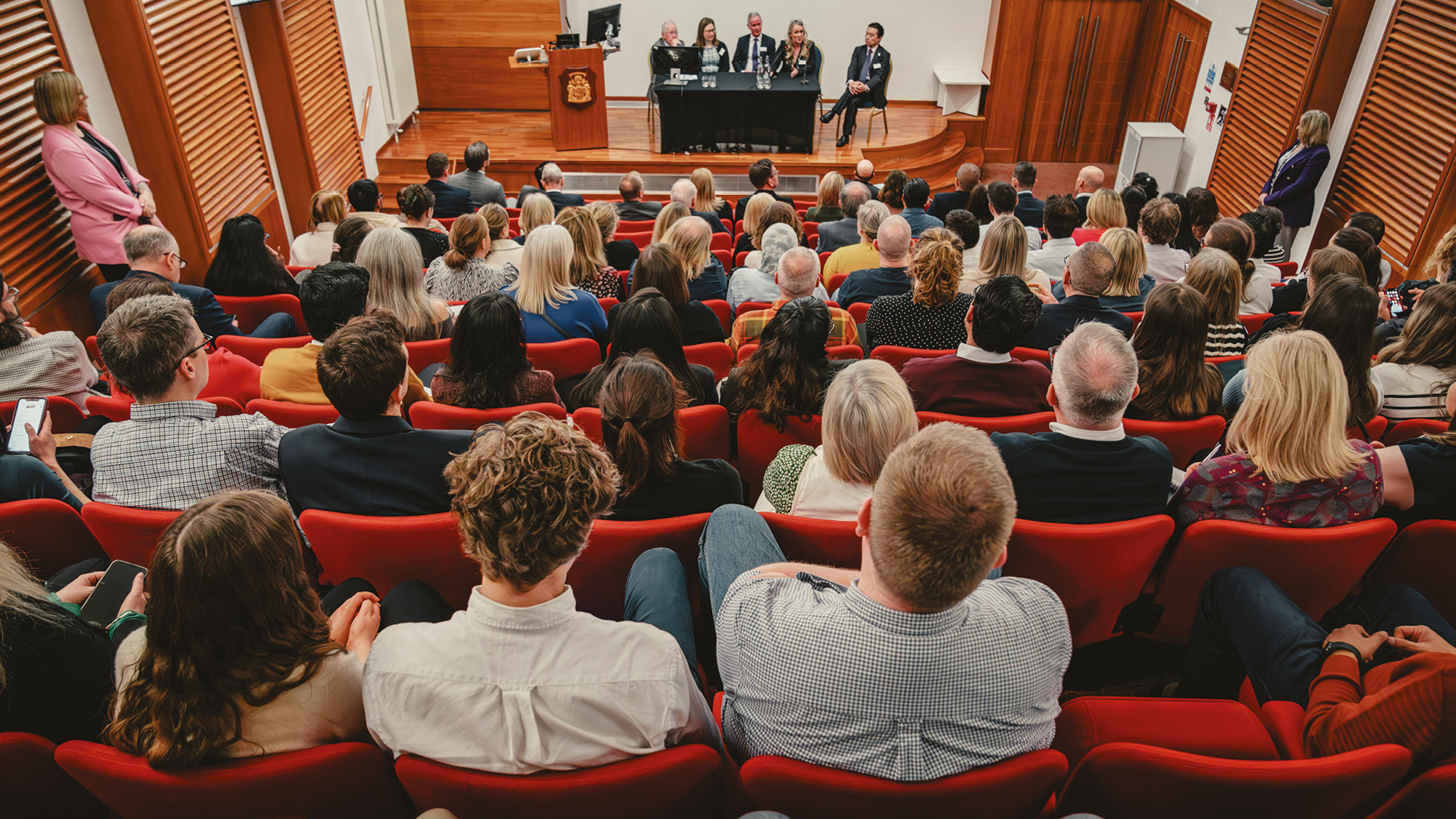 group of people in a lecture theatre 