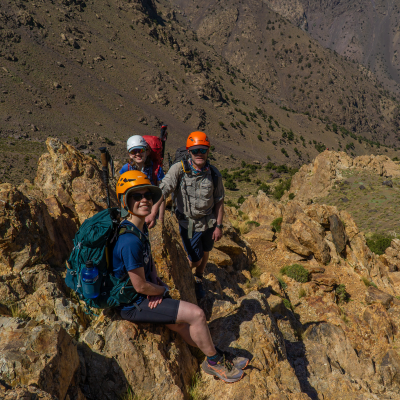 a group sitting on top of a mountain