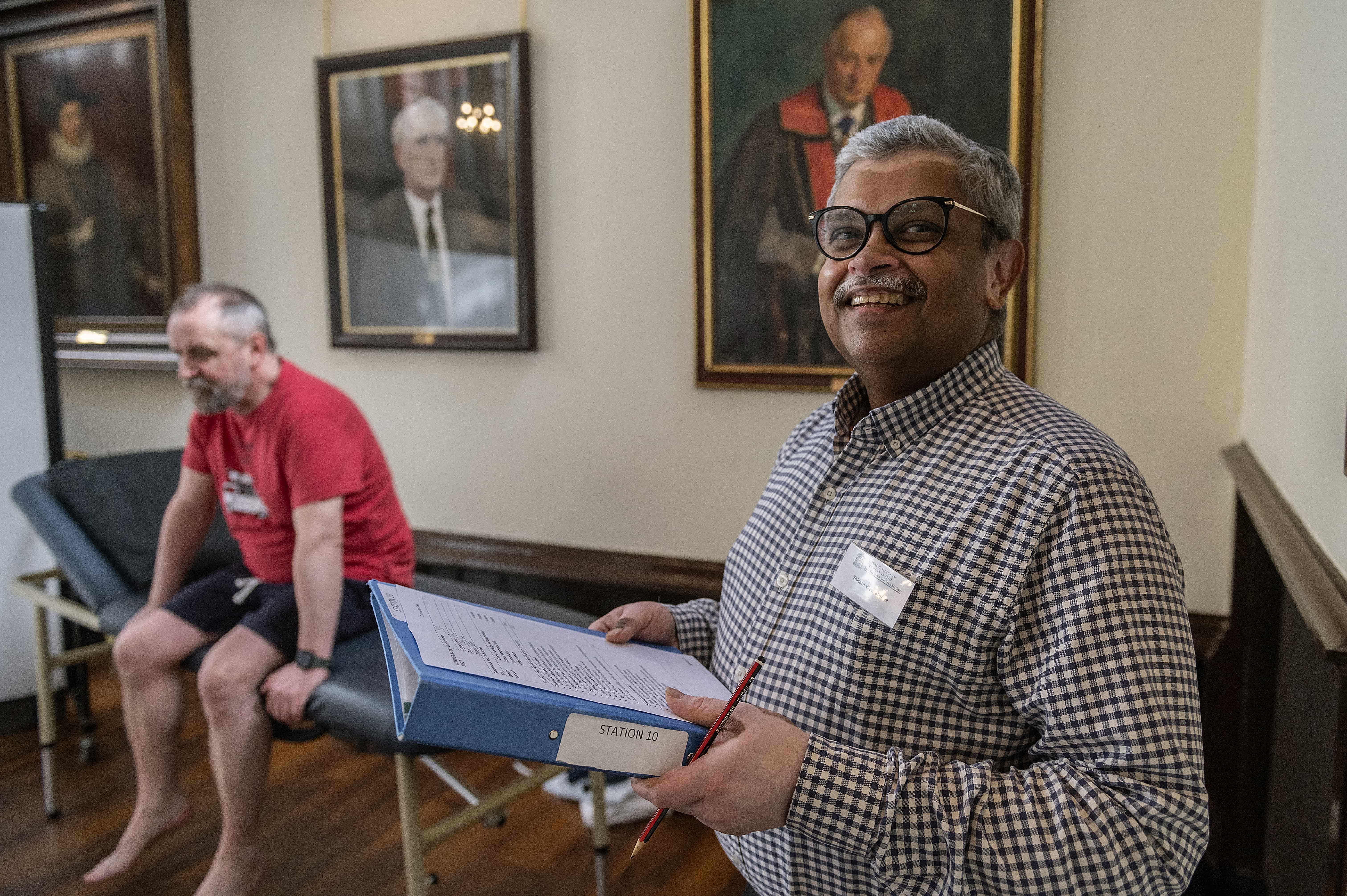 a smiling examiner at mrcs preparation course