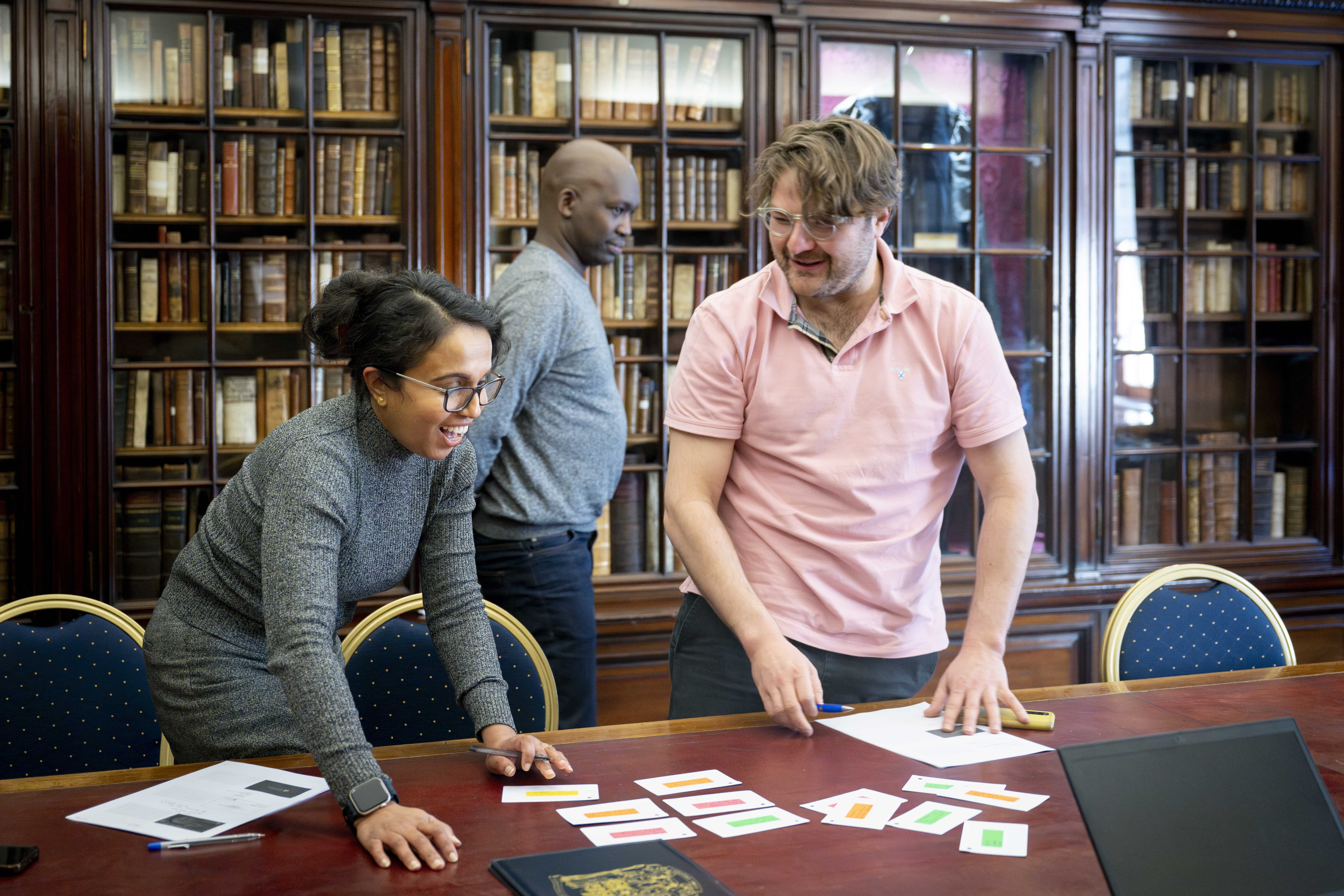 a group carrying out an activity with coloured cards
