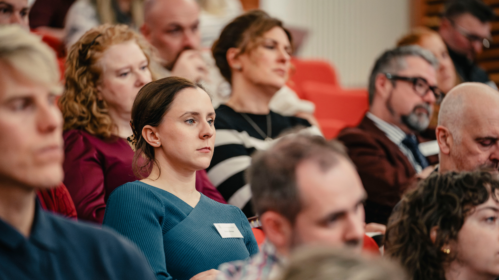 Close up of people listening in a conference