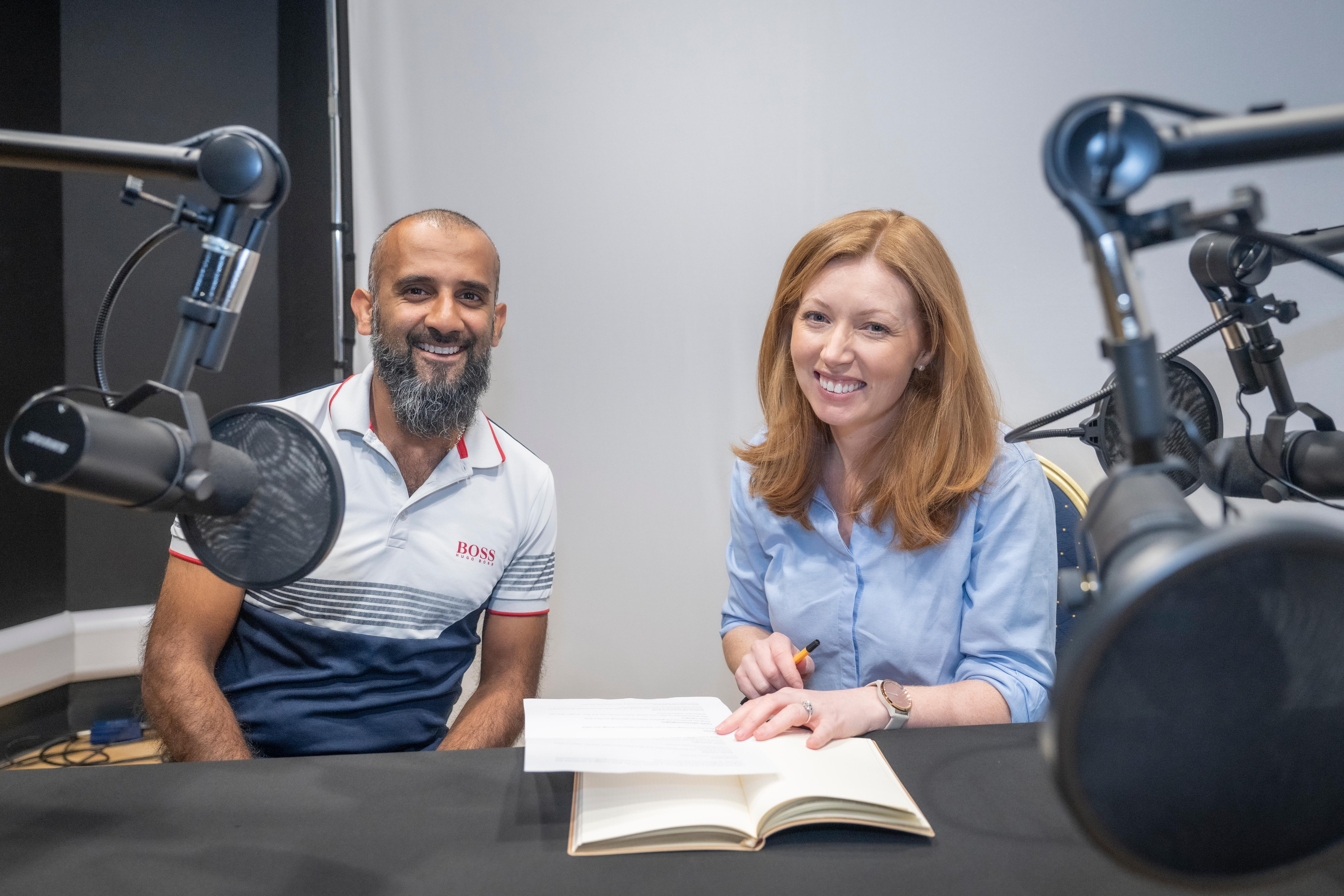 Dental podcast hosts Mohammad A Samad and Gemma Gaw behind mics smiling