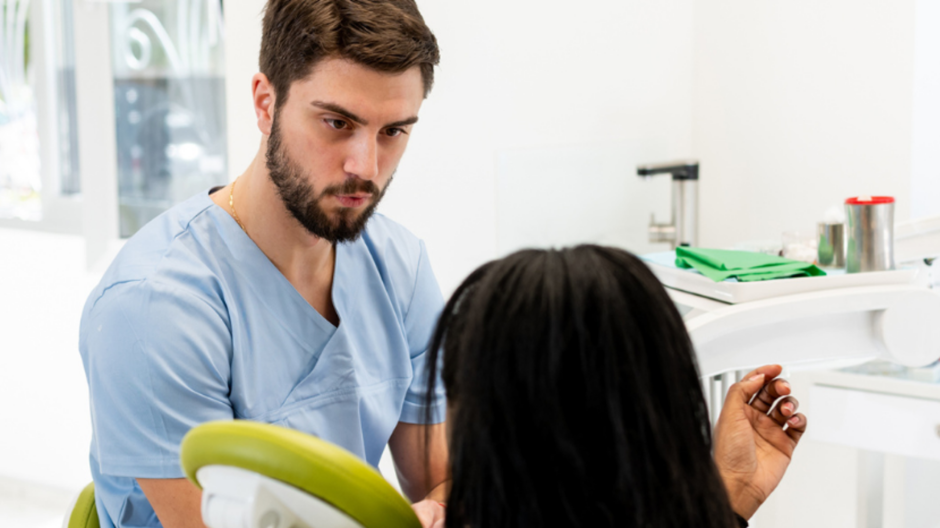 A doctor with a patient in a clinical environment