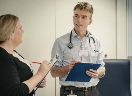 Clinicians discussing during an exam
